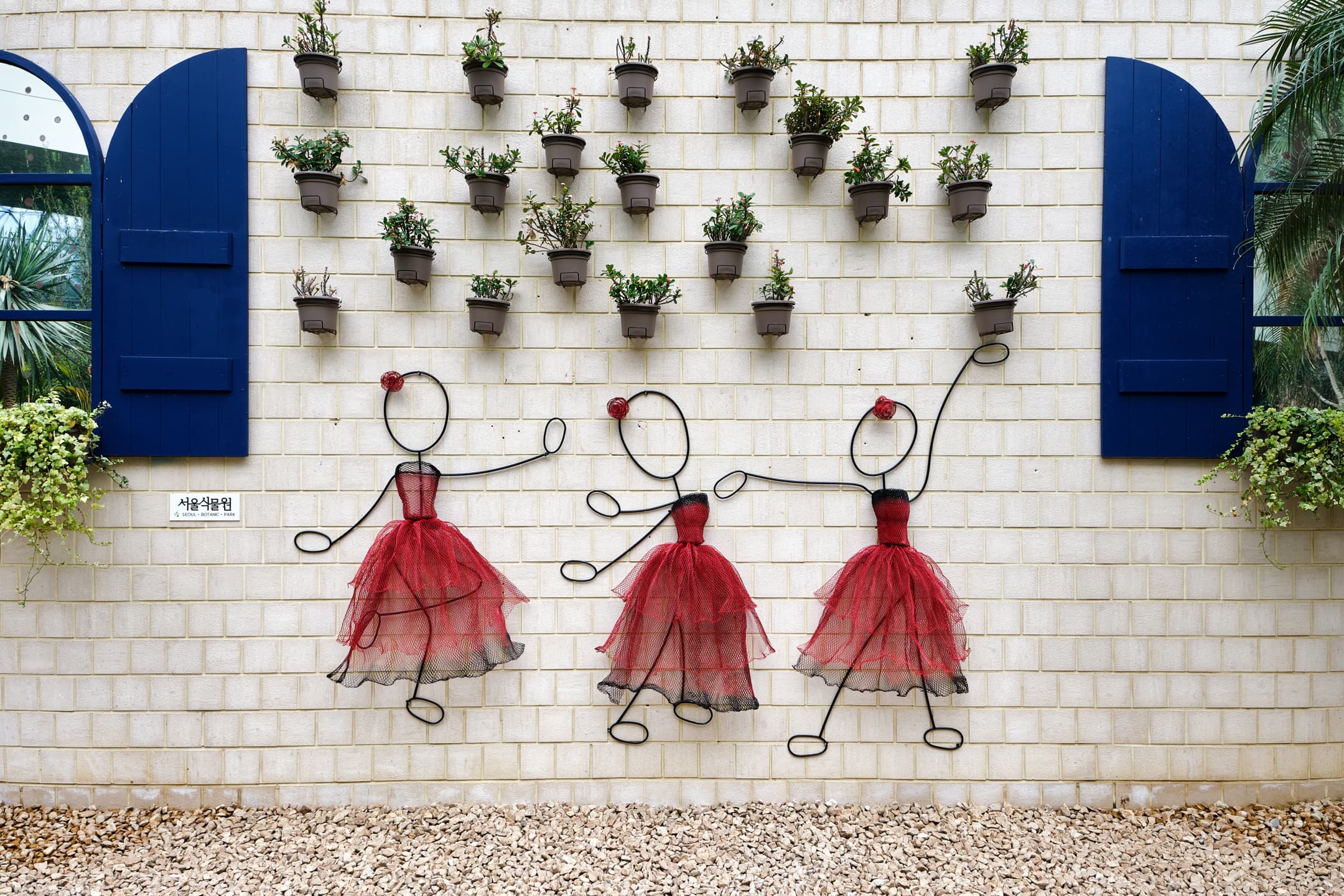 Sculptures of dancers on a wall