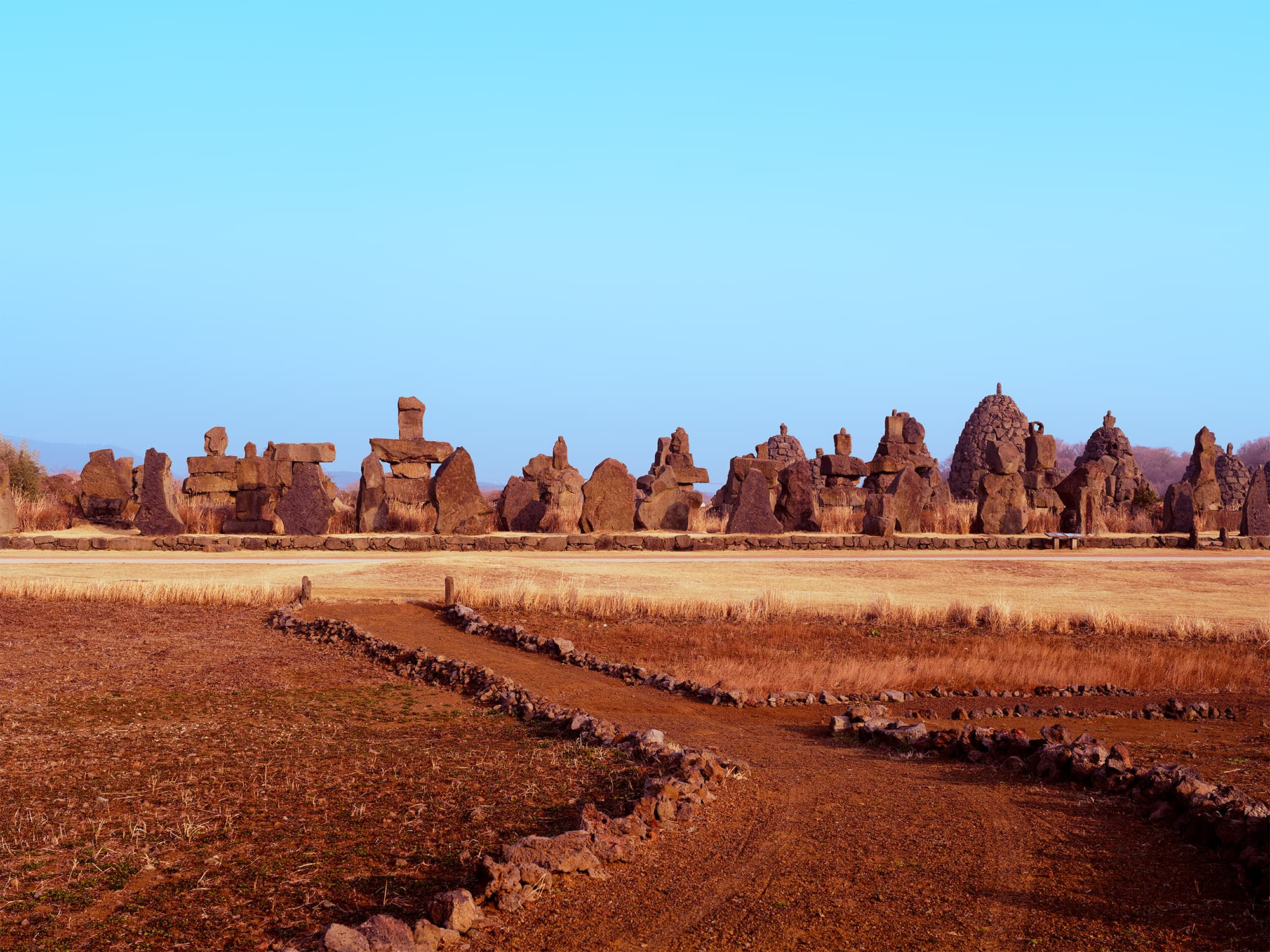 Panoramic view of Jeju Stone Park under golden light