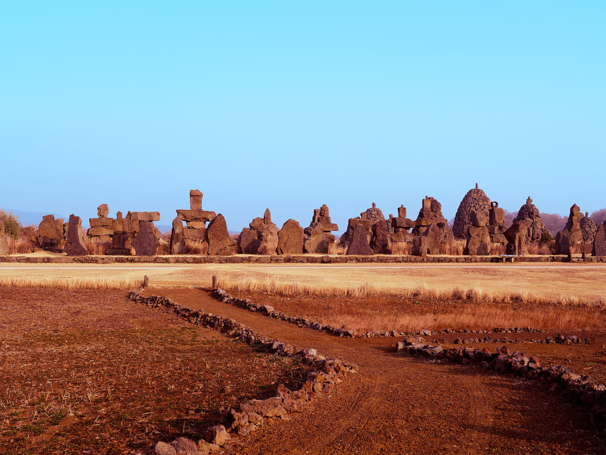 Panoramic view of Jeju Stone Park under golden light